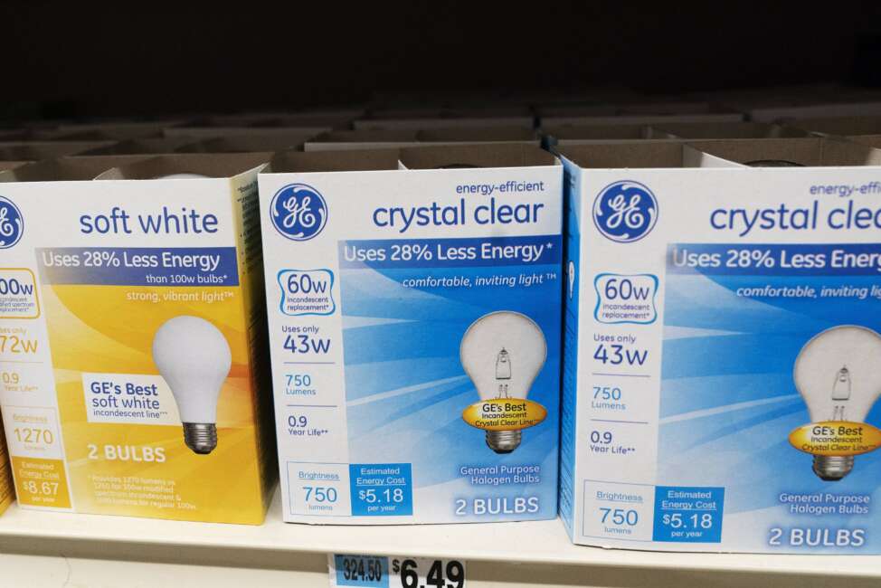 FILE - General Electric light bulbs are displayed in a supermarket April 5, 2021 in New York. The Biden administration is scrapping old-fashioned incandescent light bulbs. Rules finalized by the Energy Department will require manufacturers to sell energy-efficient lightbulbs, accelerating a longtime industry practice to use compact fluorescent and LED bulbs that last 25 to 50 times longer than incandescent bulbs. (AP Photo/Mark Lennihan, File)