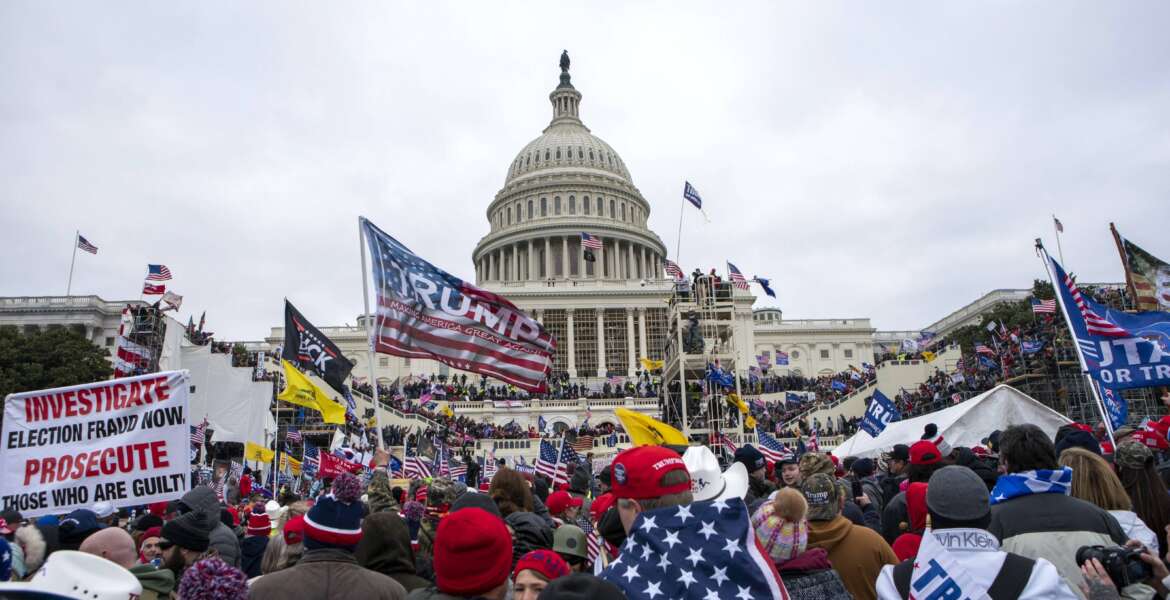 FILE - Rioters loyal to President Donald Trump rally at the U.S. Capitol in Washington on Jan. 6, 2021.    A Georgia man affiliated with the Oath Keepers militia group became the second Capitol rioter to plead guilty to seditious conspiracy for his actions leading up and through the attack. The sentencing guidelines for Brian Ulrich, who also pleaded guilty to obstructing an official proceeding, were estimated to be 5 ¼ years to 6 ½ years in prison. (AP Photo/Jose Luis Magana, File)