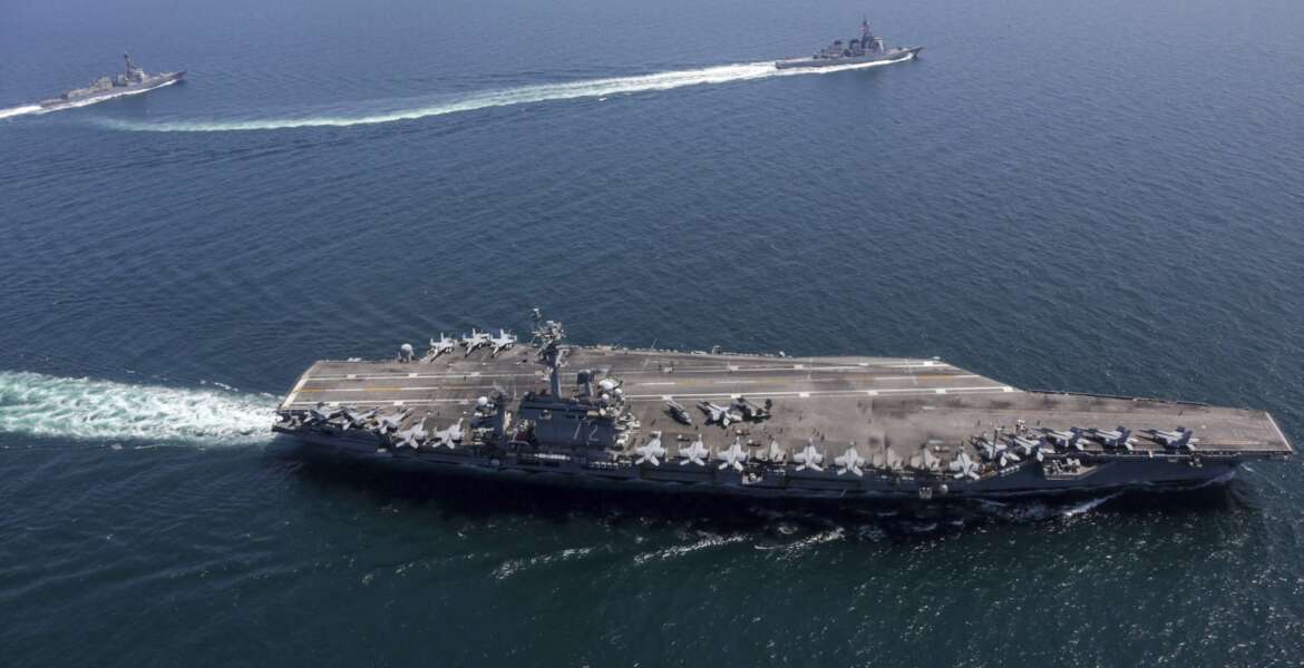 This undated photo provided by the U.S. Navy on April 13, 2022, shows USS Abraham Lincoln, front, and other warships sail in formation during a U.S.-Japan bilateral exercise at the Sea of Japan. U.S. and Japanese warships, led by the USS Abraham Lincoln carrier strike group, are conducting their joint naval exercise in waters between Japan and the Korean Peninsula for the first time in five yeas, in a show of their close military alliance amid growing speculation of North Korea's missile or nuclear testing later this week. (U.S. Navy via AP)