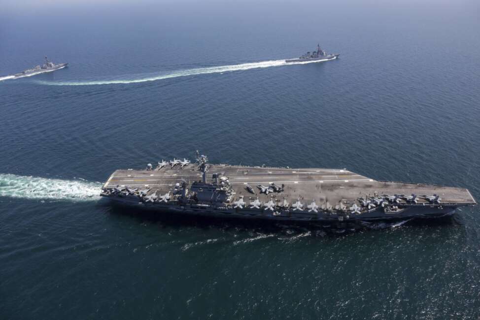 This undated photo provided by the U.S. Navy on April 13, 2022, shows USS Abraham Lincoln, front, and other warships sail in formation during a U.S.-Japan bilateral exercise at the Sea of Japan. U.S. and Japanese warships, led by the USS Abraham Lincoln carrier strike group, are conducting their joint naval exercise in waters between Japan and the Korean Peninsula for the first time in five yeas, in a show of their close military alliance amid growing speculation of North Korea's missile or nuclear testing later this week. (U.S. Navy via AP)