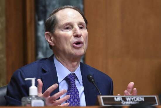 FILE - Sen. Ron Wyden, D-Ore., speaks during a Senate Finance Committee hearing Oct. 19, 2021 on Capitol Hill in Washington. A major effort to overhaul care for Americans with mental health and drug problems is gaining traction in Washington as Congress and the Biden administration work on overlapping plans to address concerns that cut across political dividing lines. (Mandel Ngan/Pool via AP, File)