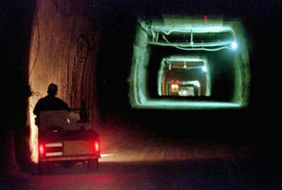 FILE - In this April 8, 1998, photo, a worker drives a cart through a tunnel inside the Waste Isolation Pilot Plant No. 2, 150 feet below the surface near Carlsbad, N.M. The U.S. government's nuclear waste repository in New Mexico has major issues in fire training and firefighting vehicles, with its fleet in disrepair after years of neglect, according to an investigation by the U.S. Energy Department's Office of Inspector General. (AP Photo/Eric Draper, File)