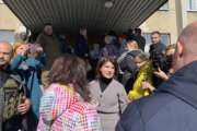 Ukraine’s Prosecutor General Iryna Venediktova speaks with refugees outside a processing center in Lviv, Ukraine on March 22, 2022. She has stationed prosecutors at refugee centers across the country and at border crossings to extract evidence from millions of displaced Ukrainians and register them as victims potentially eligible for compensation. (AP Photo/Erika Kinetz)