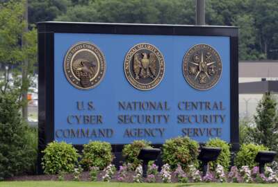 FILE - A sign stands outside the National Security Administration (NSA) campus on in Fort Meade, Md., on June 6, 2013. The national reckoning over racial inequality sparked by George Floyd's murder two years ago has gone on behind closed doors inside America's intelligence agencies. Shortly after his death, employees of the National Security Agency had a call to speak to their director about racism and cultural misunderstandings. One by one, officers spoke about examples of racism that they had seen in America's largest intelligence service.(AP Photo/Patrick Semansky, File)
