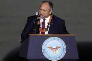 FILE - Navy Secretary Carlos Del Toro speaks at the 80th Pearl Harbor Anniversary ceremony at Joint Base Pearl Harbor-Hickam, Tuesday, Dec. 7, 2021, in Honolulu. Del Toro announced Thursday, May 19, 2022, that a future destroyer will be named USS Telesforo Trinidad in honor of a Filipino sailor who rescued two crew members when their ship caught fire more than a century ago. (AP Photo/Marco Garcia,File)