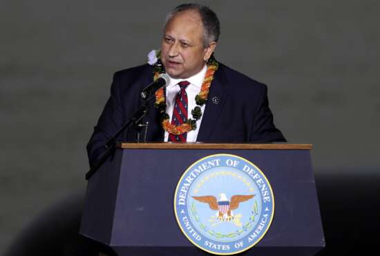 FILE - Navy Secretary Carlos Del Toro speaks at the 80th Pearl Harbor Anniversary ceremony at Joint Base Pearl Harbor-Hickam, Tuesday, Dec. 7, 2021, in Honolulu. Del Toro announced Thursday, May 19, 2022, that a future destroyer will be named USS Telesforo Trinidad in honor of a Filipino sailor who rescued two crew members when their ship caught fire more than a century ago. (AP Photo/Marco Garcia,File)