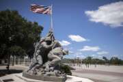 A smaller scale replica of the Marine Corps War Memorial statue stands near the parade ground at the Marine Corps Recruiting Depot, Wednesday, May 11, 2022, in Parris Island, S.C. The threat of rising seas is encroaching upon one of America's most storied military installations, where thousands of recruits are molded into Marines each year. (AP Photo/Stephen B. Morton)