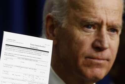 FILE - Vice President Joe Biden holds up a form for over-the-counter firearms purchases as he talks about gun legislation at the Eisenhower Executive Office Building at the White House in Washington, April 9, 2013. (AP Photo/Charles Dharapak, File)