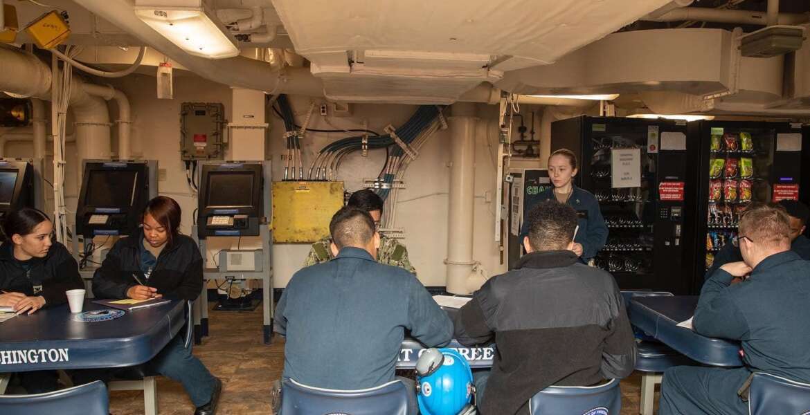 Crew on board the USS George Washington aircraft carrier.