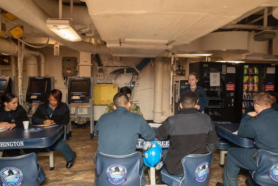 Crew on board the USS George Washington aircraft carrier.