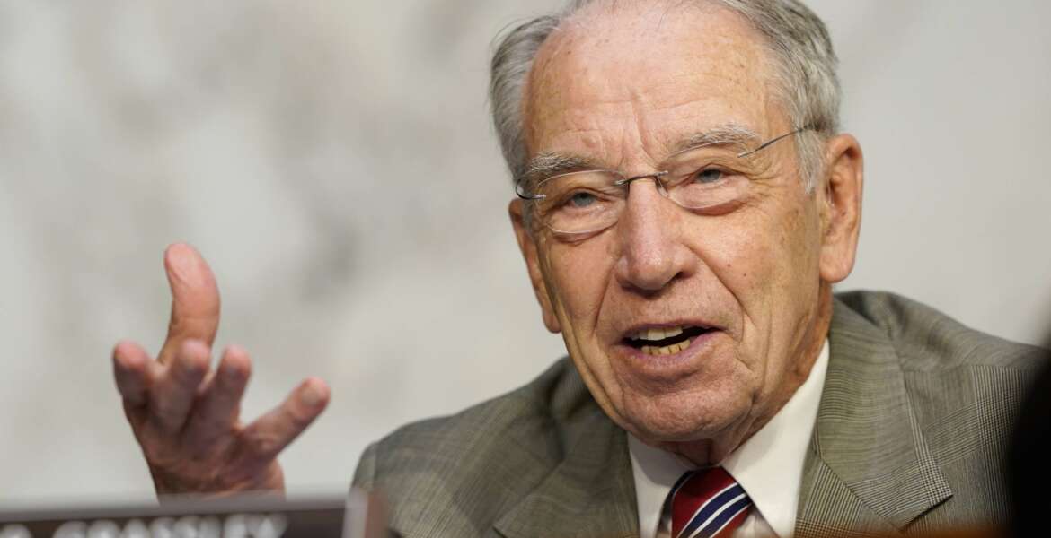 FILE - Sen. Charles Grassley, R-Iowa, speaks during the confirmation hearing for Supreme Court nominee Amy Coney Barrett, before the Senate Judiciary Committee, Tuesday, Oct. 13, 2020, on Capitol Hill in Washington. The chairman and ranking minority member of the Senate Judiciary Committee sent a letter to an advocacy group for minor leaguers asking questions about baseball's antitrust exemption. Sen. Richard Durbin, an Illinois Democrat who chairs the committee, and Charles Grassley, an Iowa Republican, sent the letter Tuesday, June 28, to Harry Marino, executive director of Advocates for Minor Leaguers.(AP Photo/Susan Walsh, Pool)