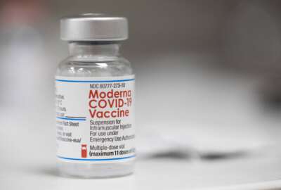 FILE - A vial of the Moderna COVID-19 vaccine is displayed on a counter at a pharmacy in Portland, Ore. on Dec. 27, 2021. U.S. health authorities are facing a critical decision: whether to offer COVID-19 booster shots this fall that better match the omicron variant even though the coronavirus already has spawned still more mutants. Moderna and Pfizer are testing updated booster candidates, and advisers to the U.S. Food and Drug Administration will debate Tuesday, June 28, 2022, if it’s time for a switch, setting the stage for similar moves by other countries. (AP Photo/Jenny Kane, File)