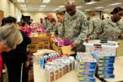 Members from Buckley and the Smokey Hill Vineyard Food Bank joined together to bring joy and wellness to military families Nov. 19, 2012, at the base chapel. Thanksgiving is near, so as a result, this food drive gave military families stability during the holidays. (U.S. Air Force photo by Airman 1st Class Darryl Bolden Jr.)