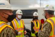 KINGS BAY, Ga., (August 4, 2021) James Balocki, (center left) Acting Principal Deputy Assistant Secretary of the Navy for Energy, Installations & Environment , and Deborah Loomis, (center right) Senior Advisor to the Secretary of the Navy for Climate Change, are given a safety brief from Capt. Miguel Dieguez, (left) public works officer of Naval Submarine Base Kings Bay, and Cmdr. Marcel Duplantier, (right) resident officer in charge of construction Trident, during a tour. The Kings Bay Dry Dock is currently undergoing a $596 million in preparation for Columbia class submarines and to extend its life into the 2080s. (U.S. Navy photo by Mass Communication Specialist 2nd Class Aaron Xavier Saldana/Released)