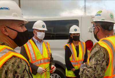KINGS BAY, Ga., (August 4, 2021) James Balocki, (center left) Acting Principal Deputy Assistant Secretary of the Navy for Energy, Installations & Environment , and Deborah Loomis, (center right) Senior Advisor to the Secretary of the Navy for Climate Change, are given a safety brief from Capt. Miguel Dieguez, (left) public works officer of Naval Submarine Base Kings Bay, and Cmdr. Marcel Duplantier, (right) resident officer in charge of construction Trident, during a tour. The Kings Bay Dry Dock is currently undergoing a $596 million in preparation for Columbia class submarines and to extend its life into the 2080s. (U.S. Navy photo by Mass Communication Specialist 2nd Class Aaron Xavier Saldana/Released)