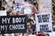 FILE - People gather in front of the Georgia State Capital in Atlanta on Friday, June 24, 2022, to protest to protest the Supreme Court's decision to overturn Roe v. Wade. Abortion rights supporters say personhood could hamper in-vitro fertilization or subject women who have abortions to murder charges. At least five states have adopted personhood laws or constitutional amendments. Georgia's law is the most extensive, granting tax breaks and child support to fetuses. (AP Photo/Ben Gray, File)