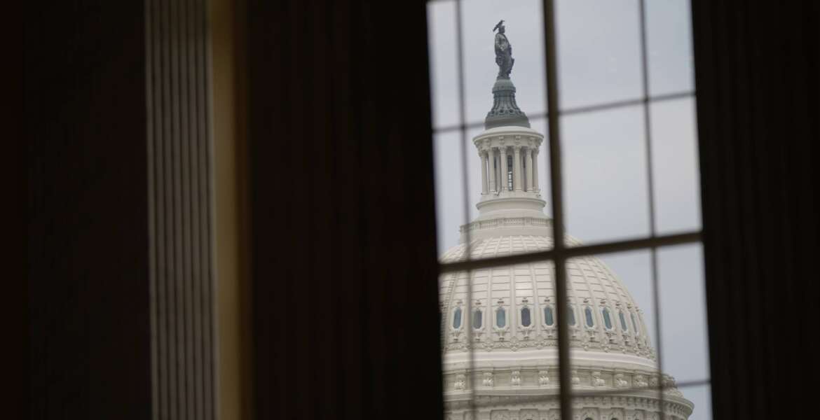 FILE - The U.S. Capitol dome is seen from a window in the Cannon House Office Building at the Capitol in Washington, June 21, 2022. Federal regulations run through American life, touching on everything we consume, the air we breathe, the water we drink. (AP Photo/Patrick Semansky, File)