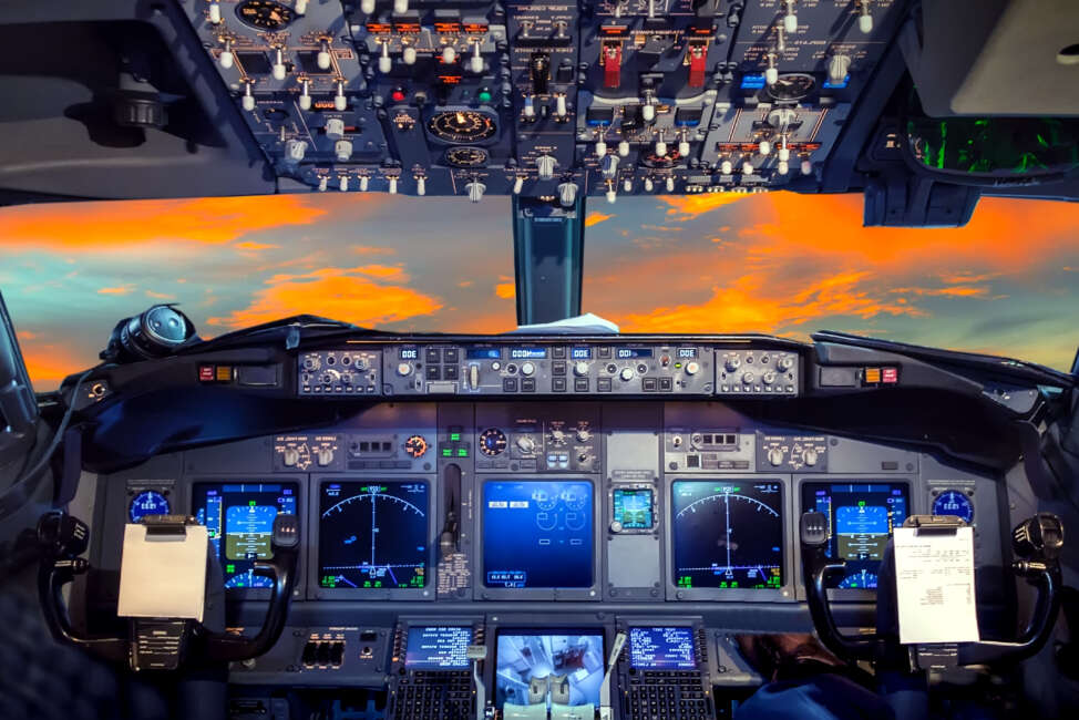 airplane cockpit Flight Deck in sunset