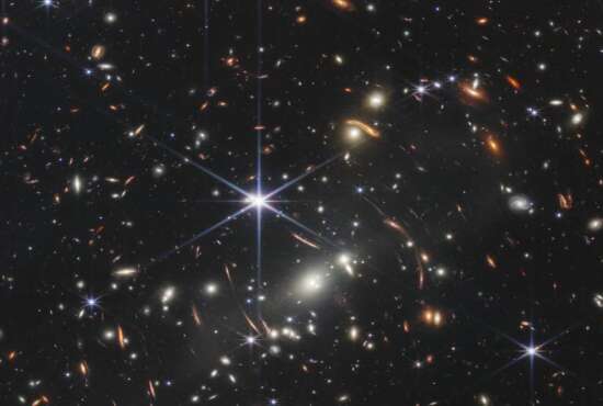 This image provided by NASA on Monday, July 11, 2022, shows galaxy cluster SMACS 0723, captured by the James Webb Space Telescope. The telescope is designed to peer back so far that scientists can get a glimpse of the dawn of the universe about 13.7 billion years ago and zoom in on closer cosmic objects, even our own solar system, with sharper focus. (NASA/ESA/CSA via AP)
