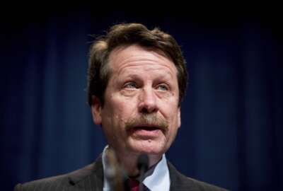 FILE - U.S. Food and Drug Administration Commissioner Dr. Robert Califf speaks at a news conference at the Hubert H. Humphrey Building in Washington, Thursday, May 5, 2016. Califf says a comprehensive review of the opioid painkillers that triggered the nation's ongoing drug overdose epidemic is in the works. But he faces skepticism about the long-promised review from lawmakers, experts and advocates after years of delay. (AP Photo/Andrew Harnik, File)