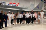 From left to right: Trent Gabriel, VBCPS Lead Teacher; Krystol Greene, Didlake Skills Trainer; Senior Chief Amber Khoryati; Interns Kristen, Kimberly, Alanna, Markus, Delaney, Trey, Chris and Jabari; Ron Newell, VBCPS Skills Trainer; Janise Varney; VBCPS Instructional Specialist; Annette Montes; VBCPS Skills Trainer; and NASO Executive Officer Steven Djunaedi (Didlake)