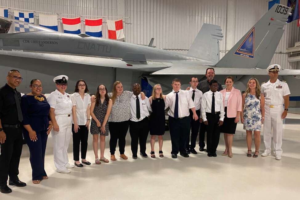 From left to right: Trent Gabriel, VBCPS Lead Teacher; Krystol Greene, Didlake Skills Trainer; Senior Chief Amber Khoryati; Interns Kristen, Kimberly, Alanna, Markus, Delaney, Trey, Chris and Jabari; Ron Newell, VBCPS Skills Trainer; Janise Varney; VBCPS Instructional Specialist; Annette Montes; VBCPS Skills Trainer; and NASO Executive Officer Steven Djunaedi (Didlake)