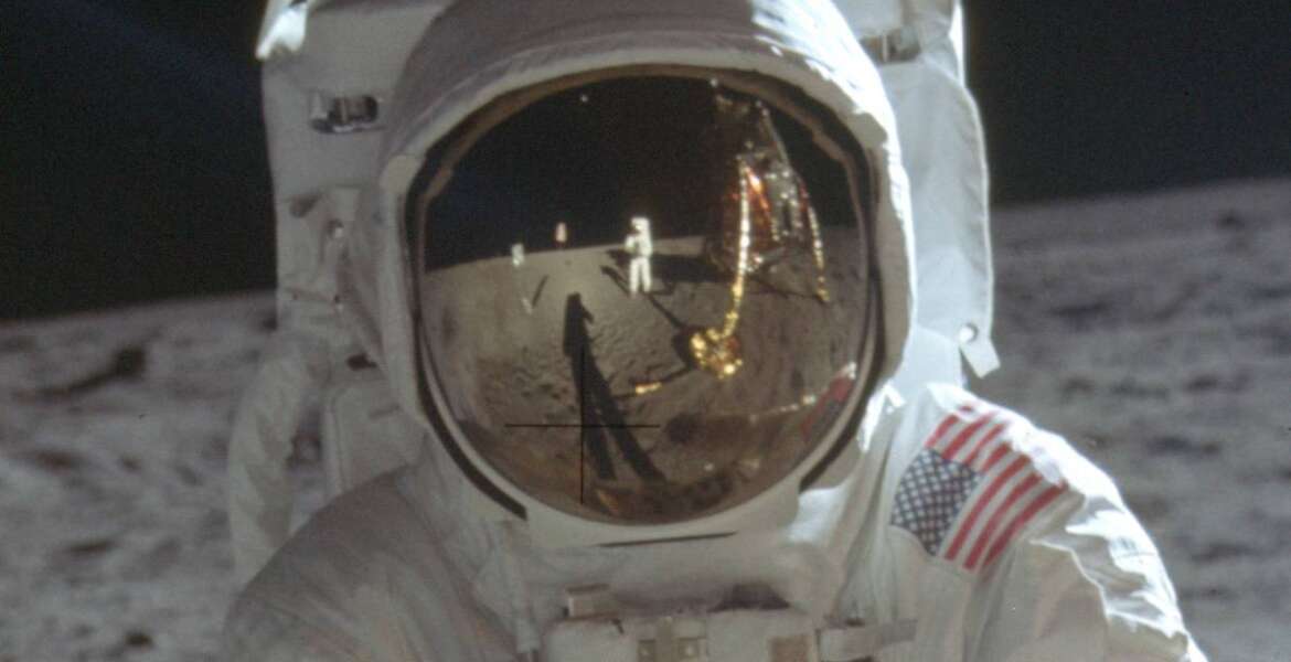 FILE - This detail of a July 20, 1969 photo made available by NASA shows astronaut Neil Armstrong reflected in the helmet visor of Buzz Aldrin on the surface of the moon. By ending 77 years of almost uninterrupted peace in Europe, war in Ukraine war has joined the dawn of the nuclear age and the birth of manned spaceflight as a watershed in history. After nearly a half-year of fighting, tens of thousands of dead and wounded on both sides, massive disruptions to supplies of energy, food and financial stability, the world is no longer as it was.(Neil Armstrong/NASA via AP)