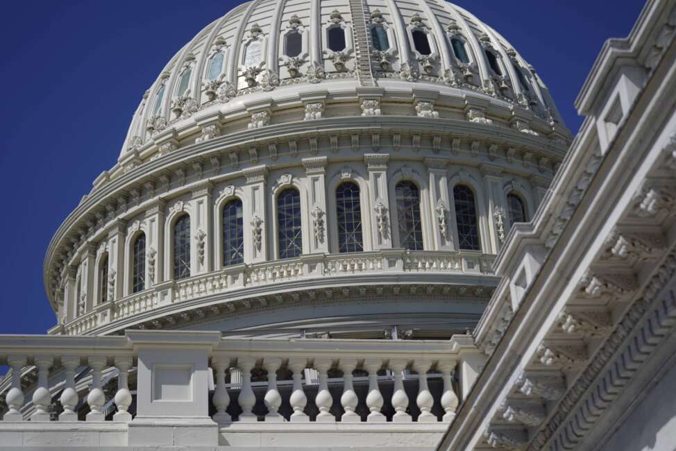 Sun shines on the U.S. Capitol dome in Washington, Friday, Aug. 12, 2022. A divided Congress gave final approval Friday to Democrats' flagship climate and health care bill. The House used a party-line 220-207 vote to pass the legislation. (AP Photo/Patrick Semansky)