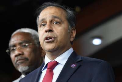 FILE - Rep. Raja Krishnamoorthi, D-Ill., speaks as Rep. Gregory Meeks, D-N.Y., listens during a news conference on Capitol Hill, Aug. 10, 2022, in Washington. Krishnamoorthi, head of the Economic and Consumer Policy subcommittee, on Aug. 30, asked leaders of the Treasury Department, Securities and Exchange Commission, Commodity Futures Trading Commission, and Federal Trade Commission for more information on the steps they are taking to curb the growth of fraud and consumer abuse linked to cryptocurrencies (AP Photo/Mariam Zuhaib, File)