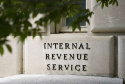 A sign outside the Internal Revenue Service building in Washington, on May 4, 2021. The Internal Revenue Service says it is conducting a comprehensive review of safety at its facilities. The action comes in response to an increasing number of threats borne of conspiracy theories that agents were going to aggressively target middle-income taxpayers. (AP Photo/Patrick Semansky)
