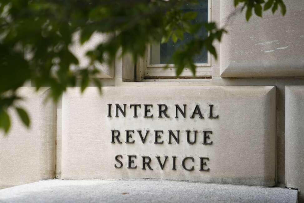 A sign outside the Internal Revenue Service building in Washington, on May 4, 2021. The Internal Revenue Service says it is conducting a comprehensive review of safety at its facilities. The action comes in response to an increasing number of threats borne of conspiracy theories that agents were going to aggressively target middle-income taxpayers. (AP Photo/Patrick Semansky)