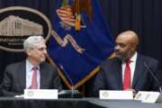 FILE - Attorney General Merrick Garland, looks at federal prosecutor Kevin Chambers, right, after appointing him to be the Justice Department's chief pandemic fraud prosecutor, during a meeting of the coronavirus disease (COVID-19) Fraud Enforcement Task Force at the Justice Department, March 10, 2022 in Washington. The U.S. Secret Service recovered $286 million in fraudulently obtained pandemic funds to the Small Business Administration, Friday, Aug. 26. (Kevin Lamarque/Pool Photo via AP, File)