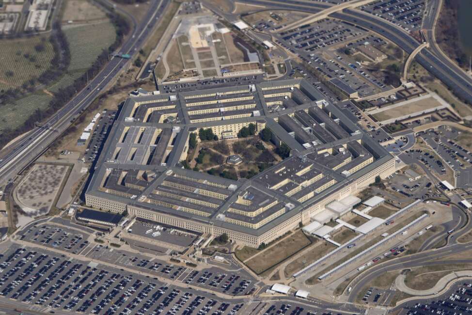 FILE - The Pentagon is seen from Air Force One as it flies over Washington, March 2, 2022. The Air Force has filed criminal charges against an airman in connection with an April explosion that injured U.S. troops at a base in eastern Syria. (AP Photo/Patrick Semansky, File)