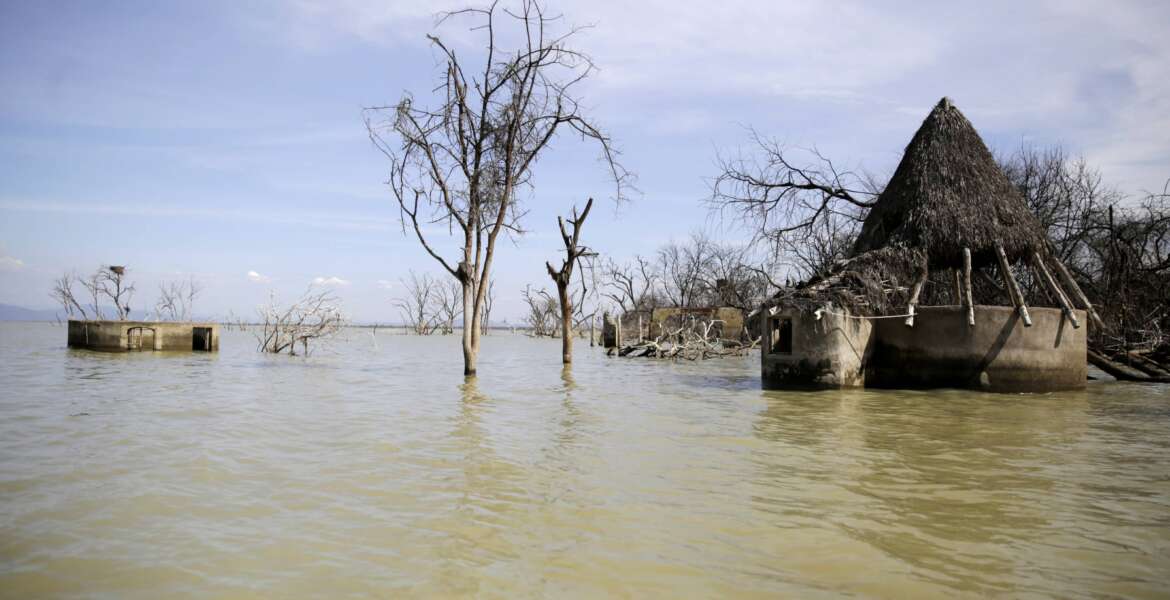 An old hotel is submerged by rising water levels in Lake Baringo in Kampi ya Samaki, Kenya on Wednesday, July 20, 2022. From drought to cyclones and sea level rise, the cost of damage caused by climate change in Africa will only get higher as the world warms, stirring concerns from activists and officials about how to pay for it.  (AP Photo/Brian Inganga)