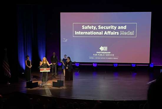 Hillary Ingraham of State Department after receiving the Safety, Security and International Affairs medal, along with Holly Herrera and Kiera Berdinner.