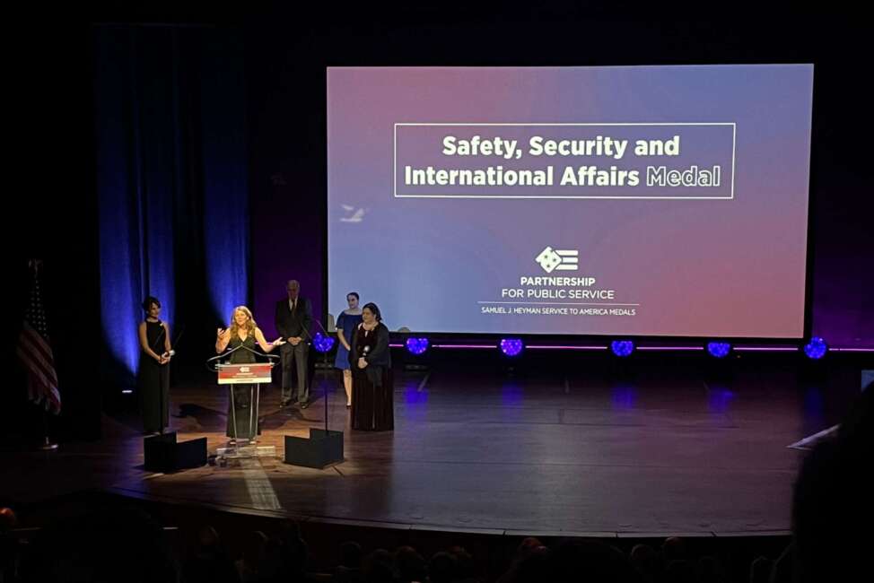 Hillary Ingraham of State Department after receiving the Safety, Security and International Affairs medal, along with Holly Herrera and Kiera Berdinner.