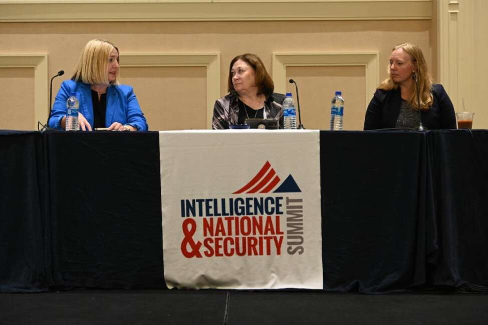 Lori Wade, intelligence community chief data officer (l), speaks with Lt. Gen. Susan Lawrence, USA (Ret.), president and CEO of AFCEA, and Kelly Fletcher, Department of Defense principal deputy chief information officer, at the Intelligence and National Security Summit 2022. Credit: Herman Farrer
