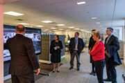 GSA chief architect Chuck Hardy (left) demonstrates the new smart board where users can to make reservations to use specific space or test out the other technologies that support the new Workplace Innovation Lab at the agency’s headquarters building in Washington, D.C(Photo courtesy GSA)