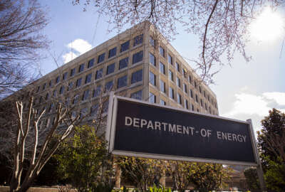 Signage stands outside the U.S. Department of Energy (DOE) headquarters in Washington, D.C., U.S, on Friday, Feb. 14, 2020. Industry leaders privately warned the Trump administration that the U.S. will struggle to deliver the oil, gas and other energy products that China has committed to buy in a new trade deal, raising additional questions about one of the president's signature economic achievements. Photographer: Andrew Harrer/Bloomberg via Getty Images