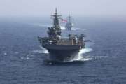 Amphibious assault ship USS Kearsarge and the Arleigh Burke-class guided-missile destroyer USS Bainbridge sail in formation.