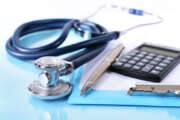 Stethoscope on light blue background