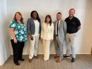 Image of Kelly Degraff with 4 FEB regional directors.