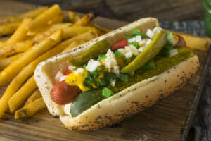 A chicago-style hot dog with french fries