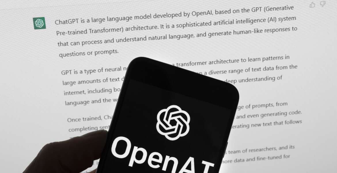 FILE - The OpenAI logo is seen on a mobile phone in front of a computer screen which displays output from ChatGPT, Tuesday, March 21, 2023, in Boston. Biden on Monday, Oct. 30, will sign a sweeping executive order to guide the development of artificial intelligence. The order will require industry to develop safety and security standards, introduce new consumer protections and give federal agencies an extensive to-do list to oversee the rapidly progressing technology. (AP Photo/Michael Dwyer, File)