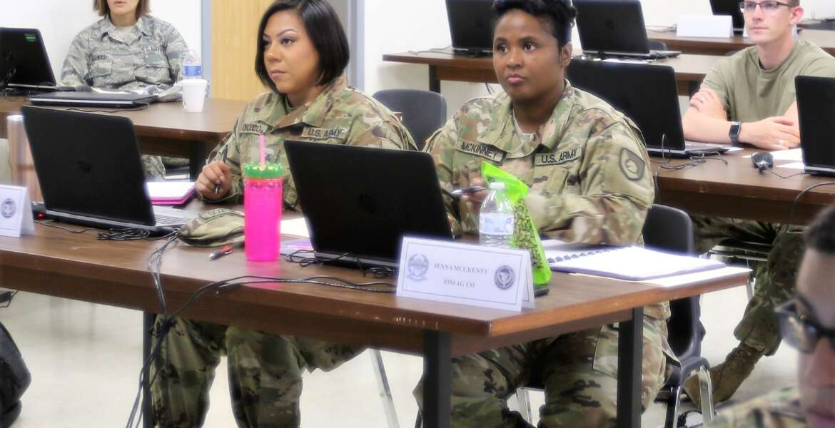 U.S. Army Reserve Sgt. 1st Class Jena McKinny and Sgt. Keila Orozco, human resources NCOs from the 350th Human Resources Company headquartered in Grand Prairie, Texas, receive training on the Defense Joint Military Pay System at Fort McCoy, Wisconsin.