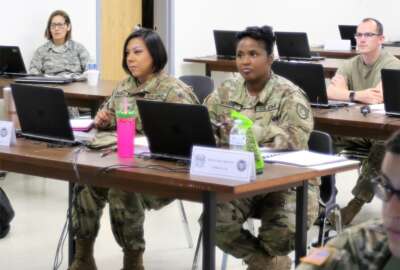 U.S. Army Reserve Sgt. 1st Class Jena McKinny and Sgt. Keila Orozco, human resources NCOs from the 350th Human Resources Company headquartered in Grand Prairie, Texas, receive training on the Defense Joint Military Pay System at Fort McCoy, Wisconsin.