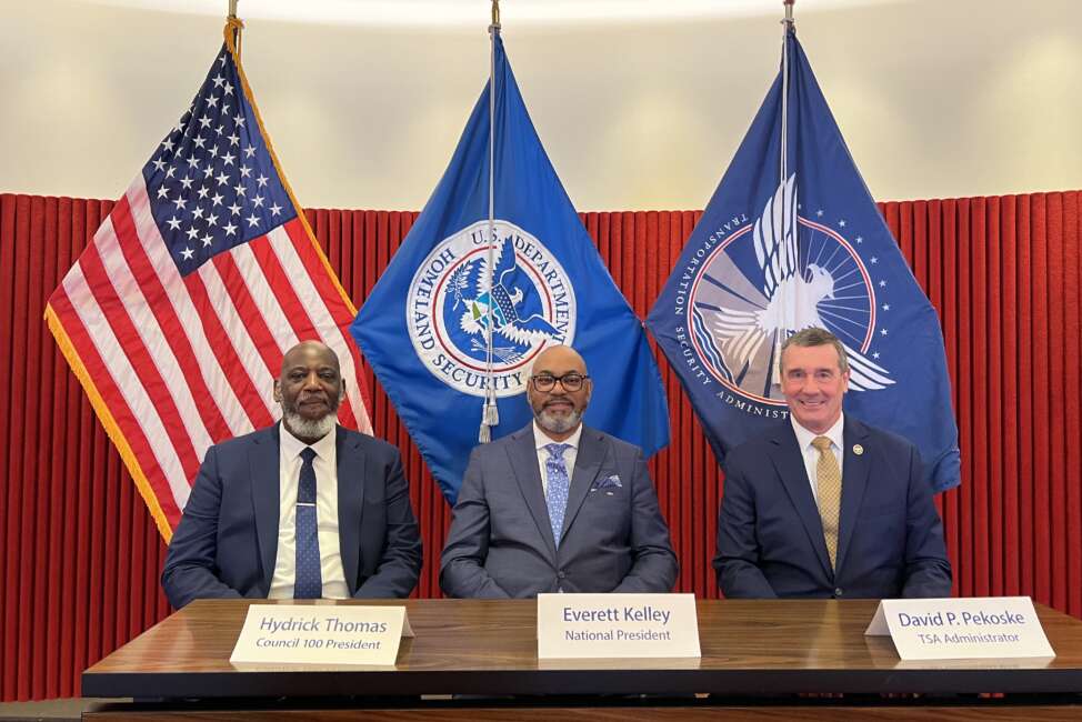 Image of leaders at AFGE and TSA at signing ceremony.