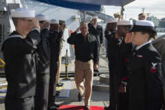 Rear Adm. Terry B. Kraft, commander of U.S. Naval Forces Japan, passes through sideboys as the official party arrives for a ship visit aboard the Arleigh Burke-class guided-missile destroyer USS Stethem (DDG 63).