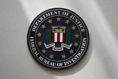 FILE - An FBI seal is seen on a wall on Aug. 10, 2022, in Omaha, Neb. (AP Photo/Charlie Neibergall, File)