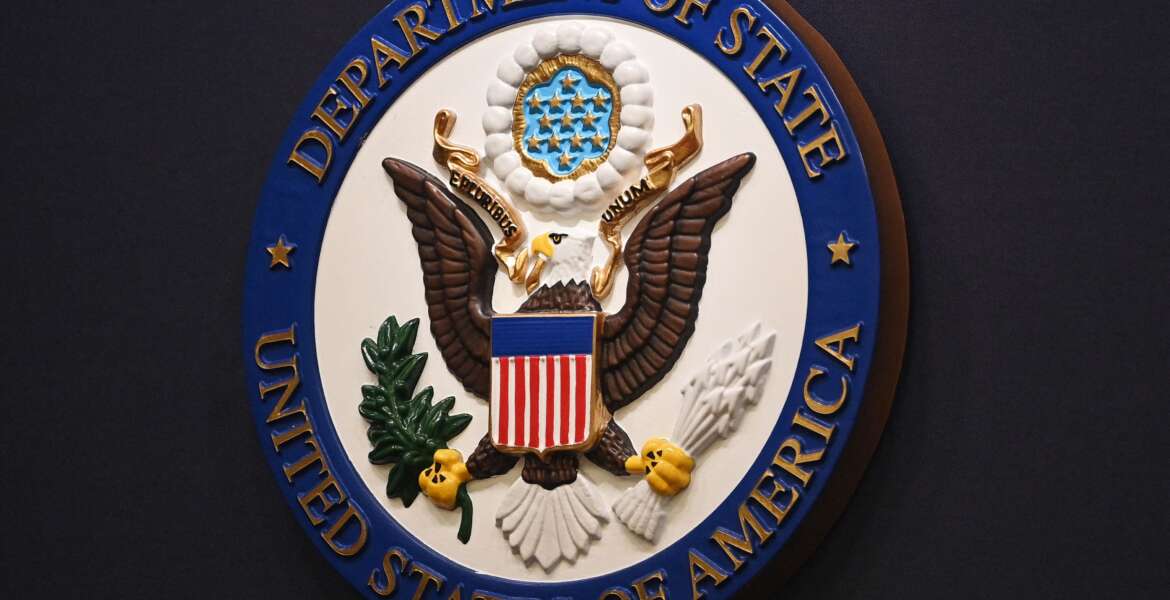 The State Department seal is seen on the briefing room lectern ahead of a briefing by State Department spokesperson Ned Price at the State Department in Washington, DC, on January 31, 2022. (Photo by MANDEL NGAN / POOL / AFP) (Photo by MANDEL NGAN/POOL/AFP via Getty Images)